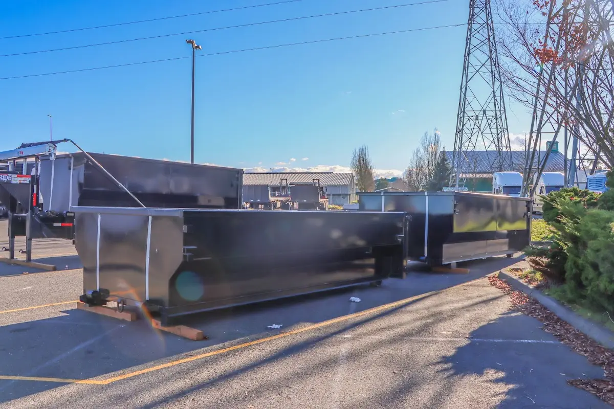 Roll-off dumpster ready for waste disposal at job site for 2 Yard Dumpster Rental in Kenai